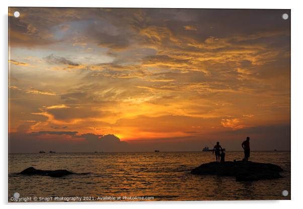 A silhouette of fishermen standing on rocks at sun Acrylic by SnapT Photography