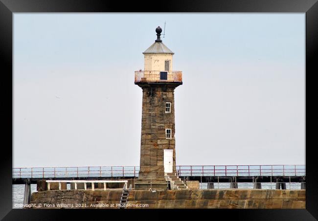 Whitby Lighthouse and pier Framed Print by Fiona Williams