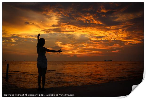 A female model silhouette controlling the movements of clouds on Ba Keo Beach Print by SnapT Photography