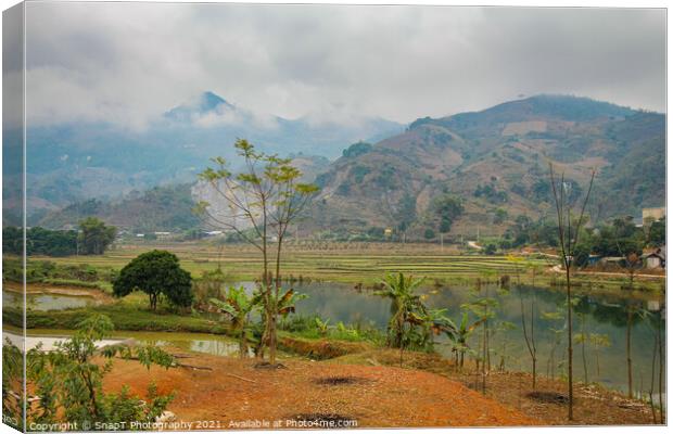A mountain and rice paddy landscape in Sapa, Vietnam, on a winters morning Canvas Print by SnapT Photography