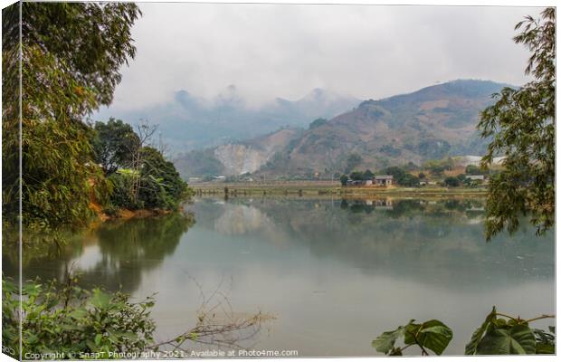 A mountain reflection on a lake in a rice paddy, Sapa, Vietnam Canvas Print by SnapT Photography