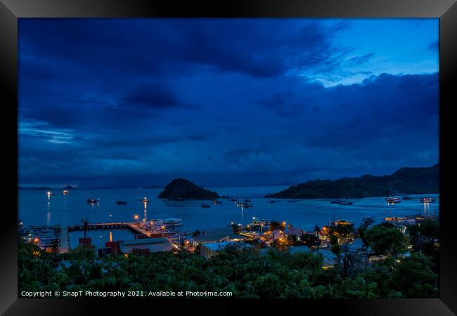Hill top view over Labuan Bajo harbour in the evening at twilight Framed Print by SnapT Photography