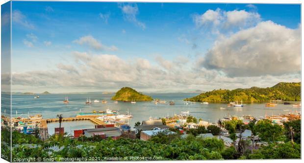 A view over the town of Labuan Bajo and harbour in the morning, Indonesia Canvas Print by SnapT Photography