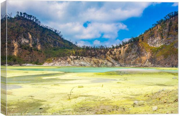 The yellow sulphur deposits and blue lake of Kawah Putih, Indonesia Canvas Print by SnapT Photography