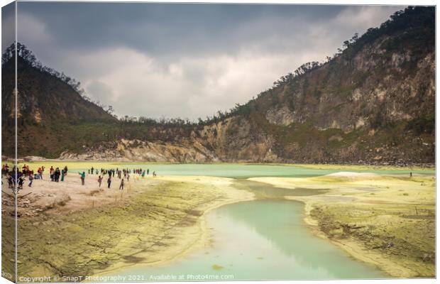 Tourists at the volcanic sulphur crater lake of Kawah Putih, Indonesia Canvas Print by SnapT Photography