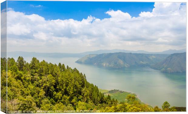 A view over the largest volcanic crater lake in the world, Lake Toba, Indonesia Canvas Print by SnapT Photography