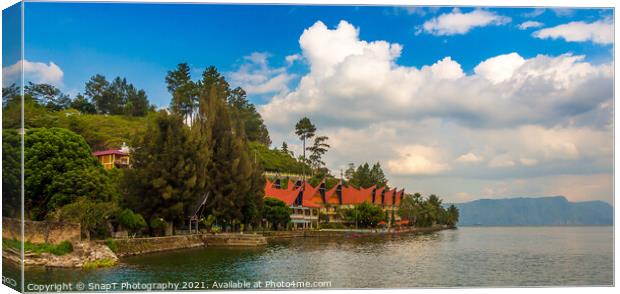 A Bataknese style resort on the shores of Danau Lake Toba, Sumatra, Indonesia Canvas Print by SnapT Photography