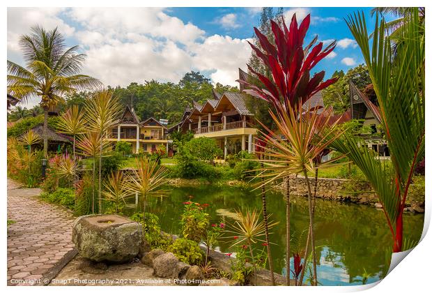 A lake and a Bataknese architecture on the shore of Lake Toba Print by SnapT Photography