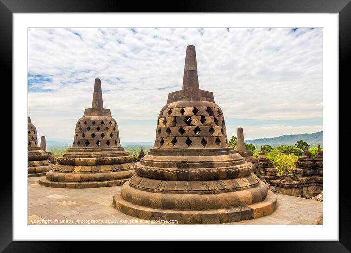 Stupas that look like bells on top of the Borobudur Buddhist temple, Indonesia Framed Mounted Print by SnapT Photography