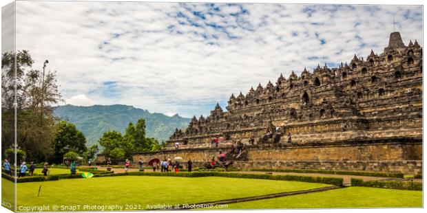 A line of tourists ascending the stairs on the Borobudur Buddhist temple, Indonesia Canvas Print by SnapT Photography