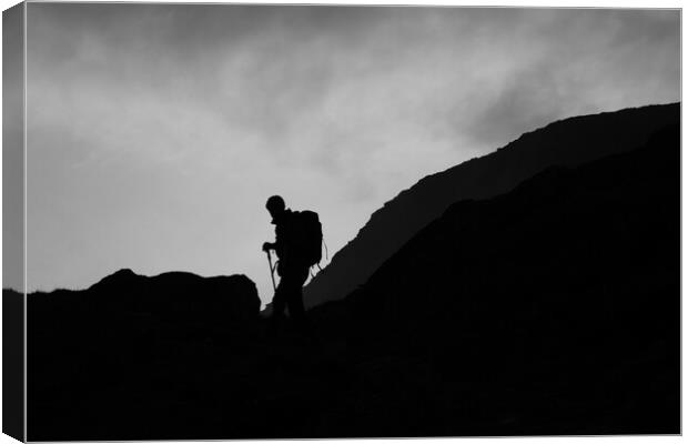 Silhouette of mountain guide  Canvas Print by Christopher Stores