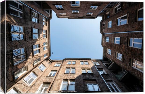 Upward view among the buildings in Warsaw Canvas Print by Sergio Delle Vedove