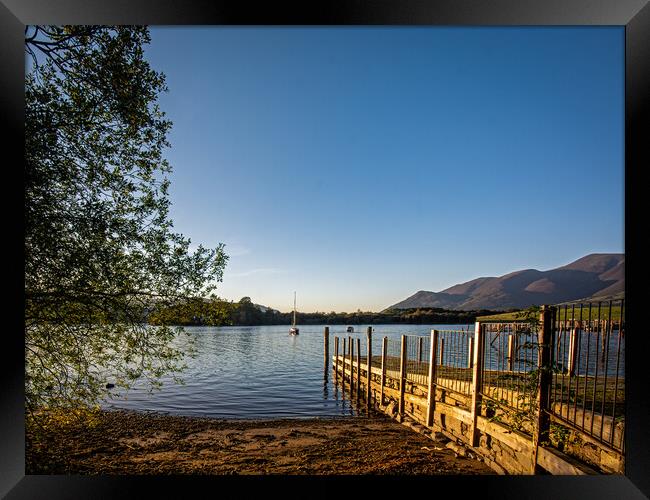 Sunlit jetty in the Lake District  Framed Print by Vicky Outen