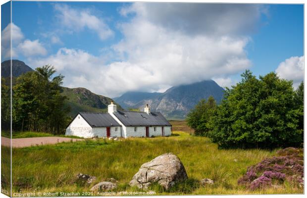 Majestic Buachaille and Rustic Black Rock Cottage Canvas Print by Robert Strachan