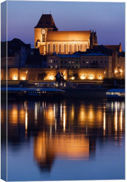 Torun Cathedral With Reflection In River Canvas Print by Artur Bogacki