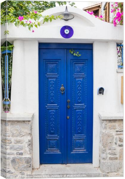 Blue door and entrance to a house  Canvas Print by Kevin Hellon