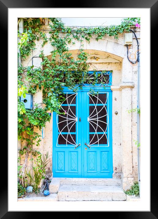 Blue door on house Framed Mounted Print by Kevin Hellon
