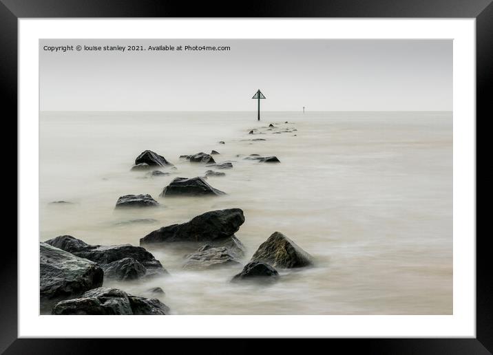 Rising tide over stone groin Framed Mounted Print by louise stanley