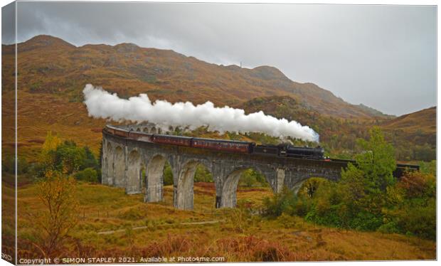 Jacobite Steam Train On Glenfinnan Viaduct In Autu Canvas Print by SIMON STAPLEY
