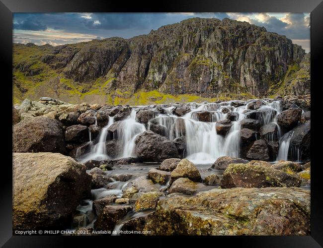 Stickle tarn waterfall  situated in the Langdale area of Cumbria  Framed Print by PHILIP CHALK
