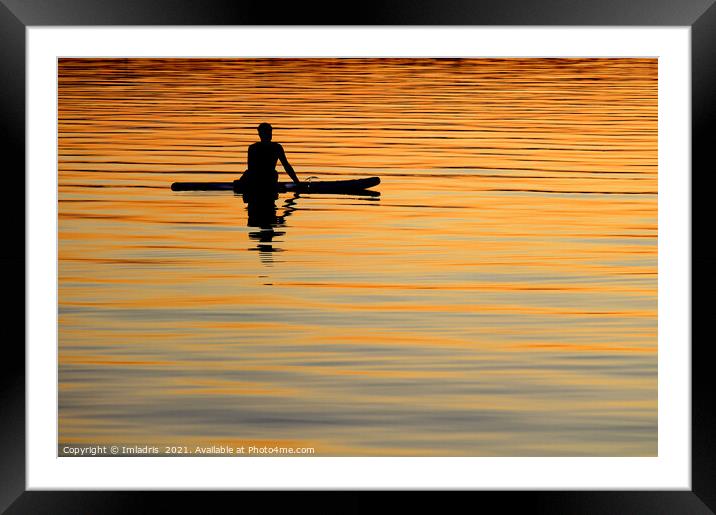 Silhouetted paddle boarder peaceful sunset Framed Mounted Print by Imladris 
