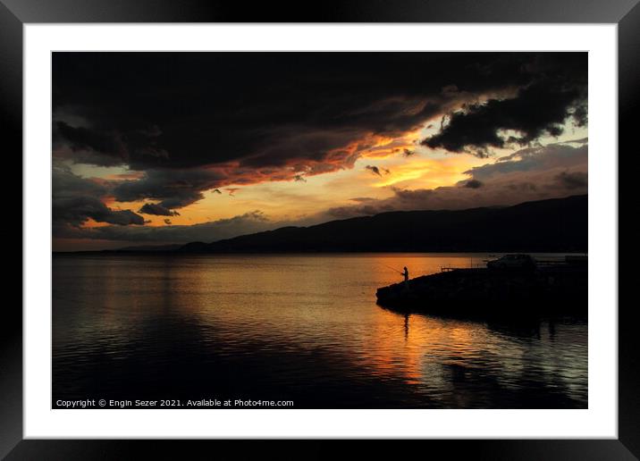 A colorful idyllic sunset after rain and dark clou Framed Mounted Print by Engin Sezer