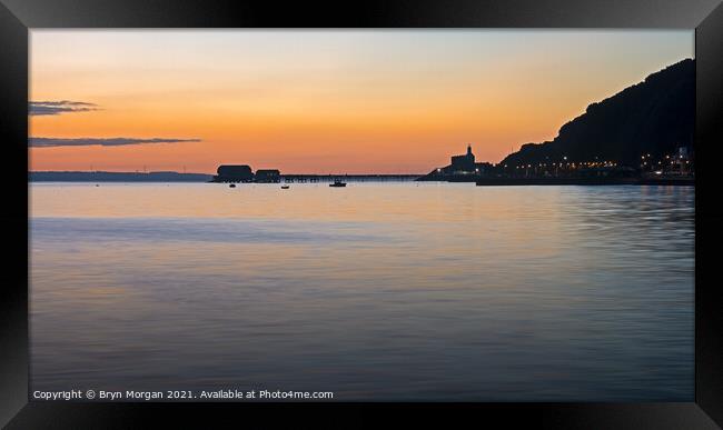 Mumbles lighthouse and pier at sunrise Framed Print by Bryn Morgan