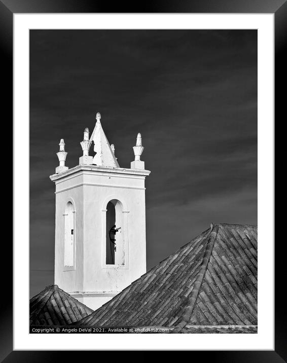 Church bell tower behind tiled roofs in Tavira Framed Mounted Print by Angelo DeVal