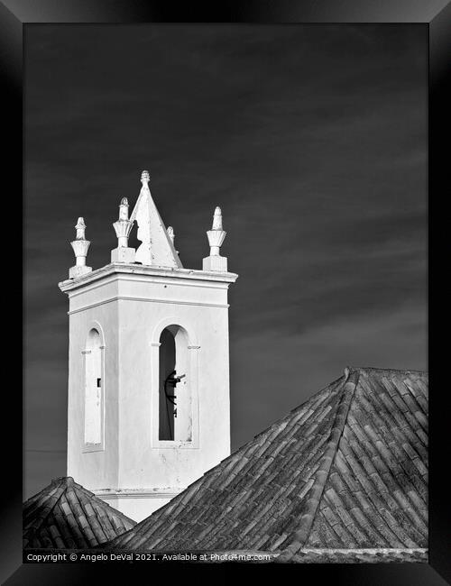 Church bell tower behind tiled roofs in Tavira Framed Print by Angelo DeVal