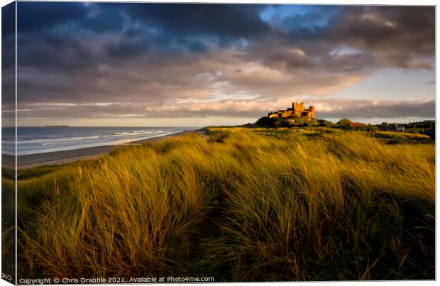 Sunset at Bamburgh Castle Canvas Print by Chris Drabble