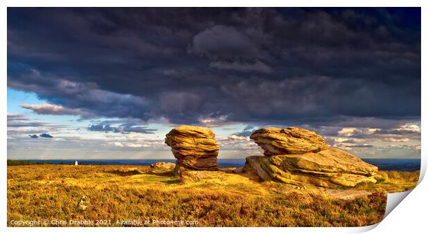 The Ox Stones caught in storm light Print by Chris Drabble