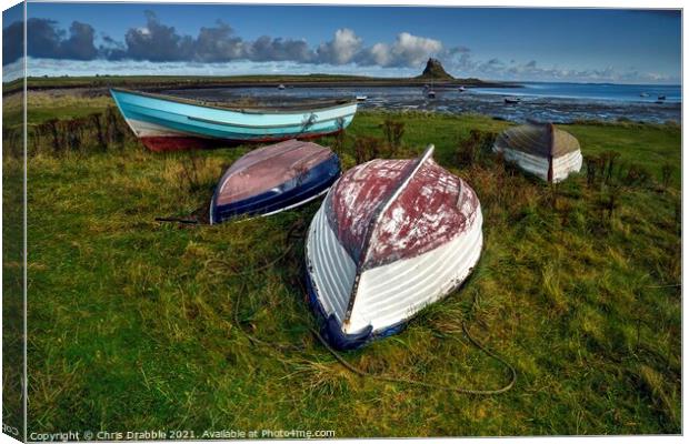 Fishing boats at Lindisfarne Canvas Print by Chris Drabble