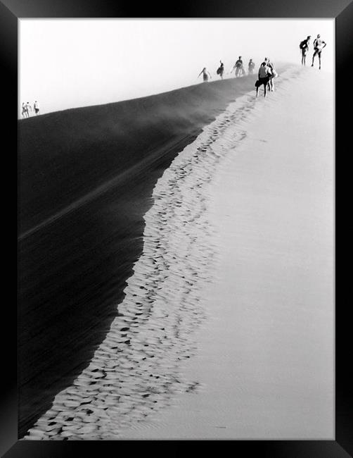 Climbing the Dune Framed Print by Serena Bowles
