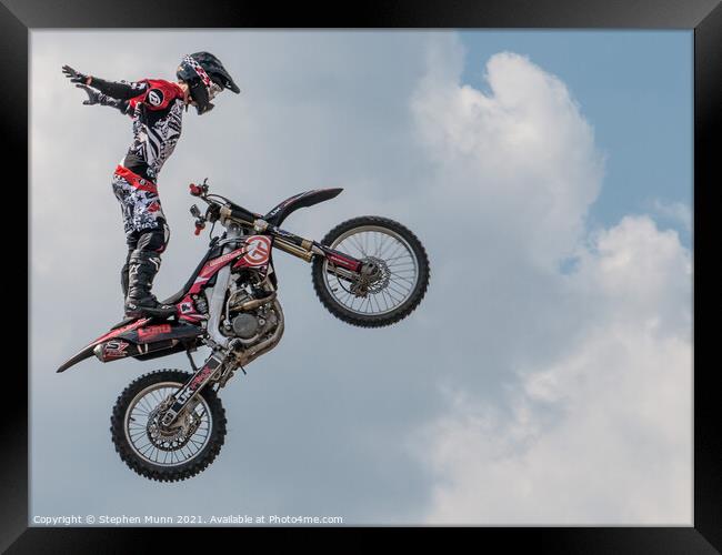 Flying Motorbike Stunt Man Framed Print by Stephen Munn