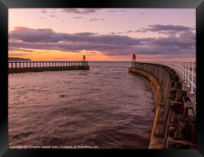 Whitby Harbour as the Sun Sets Framed Print by Christine Newell