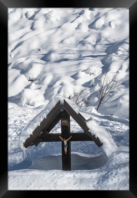 crucifix in winter Framed Print by Sergio Delle Vedove