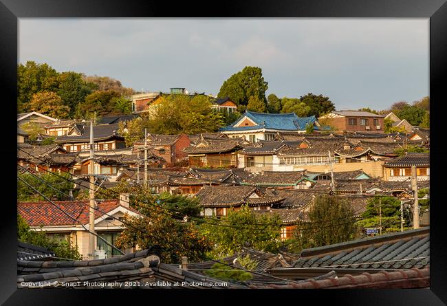 The Korean architechture in the roof tops of Bukchon Hanok Village in Seoul Framed Print by SnapT Photography