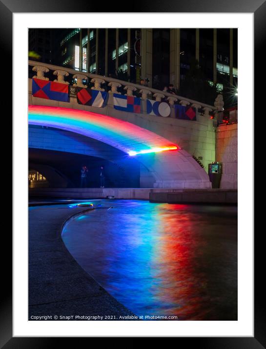 A rainbow reflecting on the Cheonggyecheon Stream at Gwangtonggyo Bridge Framed Mounted Print by SnapT Photography