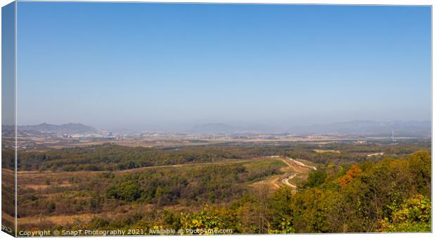 The border fence running through the Korean DMZ from South Korea Canvas Print by SnapT Photography