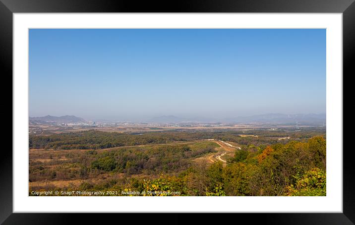 The border fence running through the Korean DMZ from South Korea Framed Mounted Print by SnapT Photography