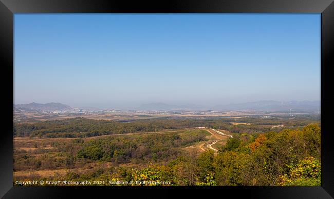 The border fence running through the Korean DMZ from South Korea Framed Print by SnapT Photography
