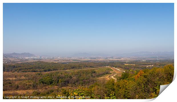 The border fence running through the Korean DMZ from South Korea Print by SnapT Photography