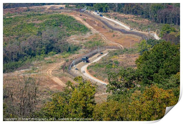 Highly fortified border fence at the Korean DMZ, with watch towers, South Korea Print by SnapT Photography