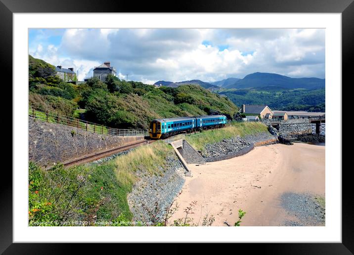 Coastal train at Barmouth in Wales. Framed Mounted Print by john hill