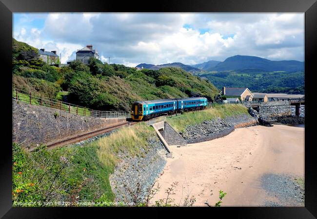 Coastal train at Barmouth in Wales. Framed Print by john hill