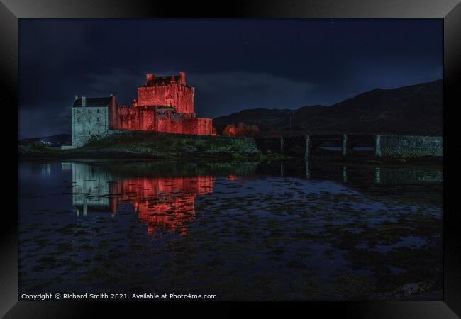Red and white floodlighting of Eilean Donan Castle for Remembrance Sunday Framed Print by Richard Smith