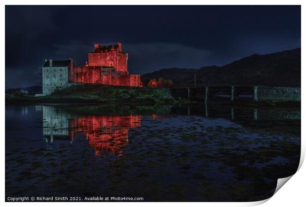 Red and white floodlighting of Eilean Donan Castle for Remembrance Sunday Print by Richard Smith