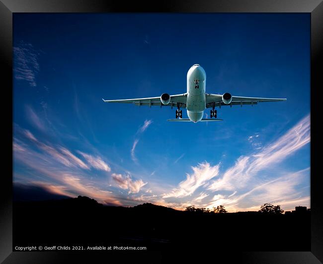 Jet Airliner Flying in a sunset sky. Framed Print by Geoff Childs
