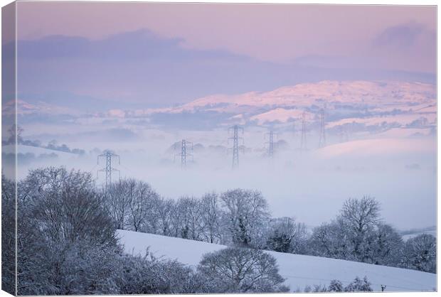 Pylons in the Mist Canvas Print by Clive Ashton