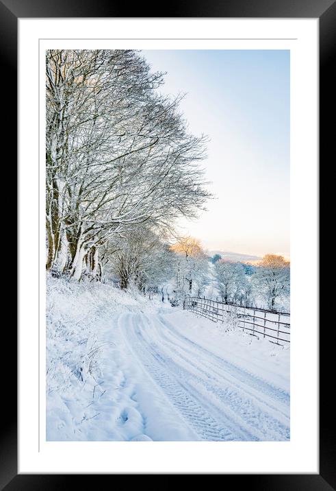 The snowy road home Framed Mounted Print by Clive Ashton